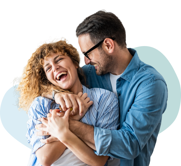 Couple hugging and laughing