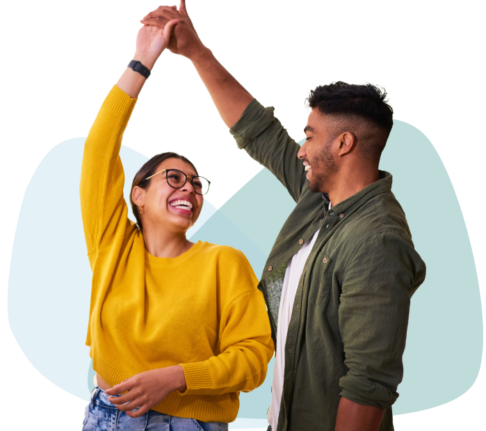 Young couple dancing & smiling