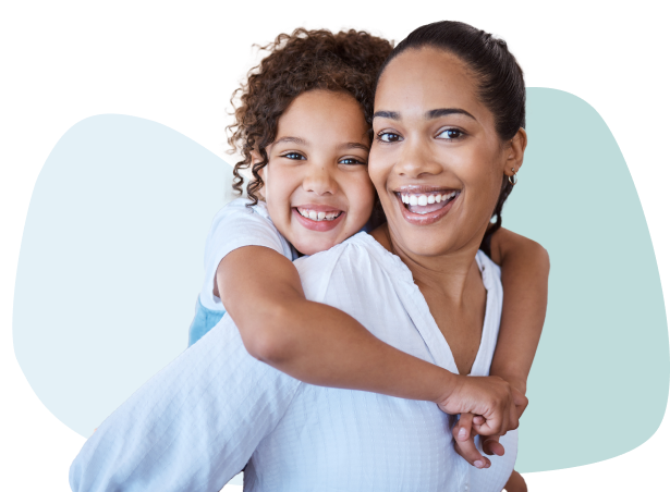 Young mom & daughter smiling