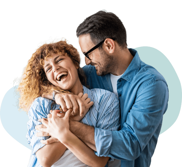 Couple hugging and laughing