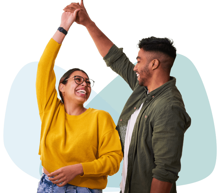 Young couple dancing & smiling