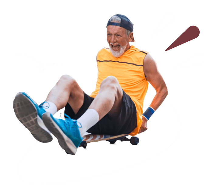 Elderly man on skateboard laughing